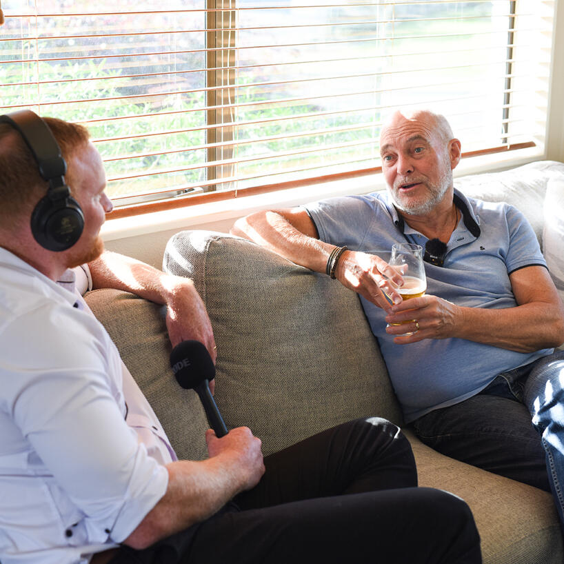 life-story-studio-man-being-recorded.jpg A man sat casually, taking part in an audio interview wth Jordan Brannigan, in a comfortable living room setting.